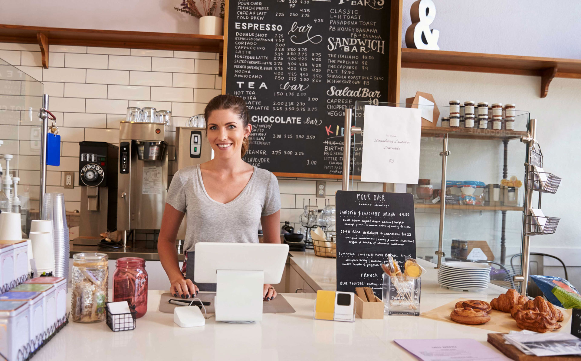 woman-ready-to-serve-behind-the-counter- woman-ready-to-serve-behind-the-counter-